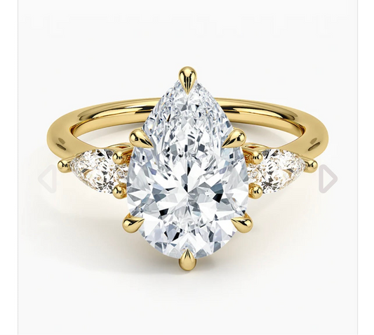 3 carat IGI certified lab diamond VS1 F pear. 0.5ctx2 side stones. Yellow gold 18K