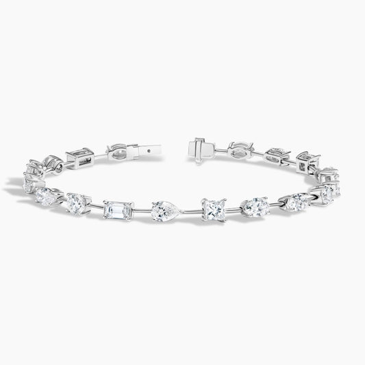 White gold bracelet with assorted diamond cuts on white background, luxury fine jewelry