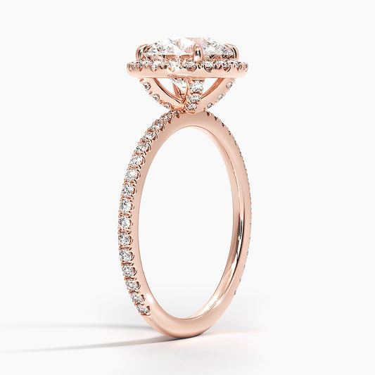 Rose gold halo engagement ring with round lab-grown diamond and pavé band