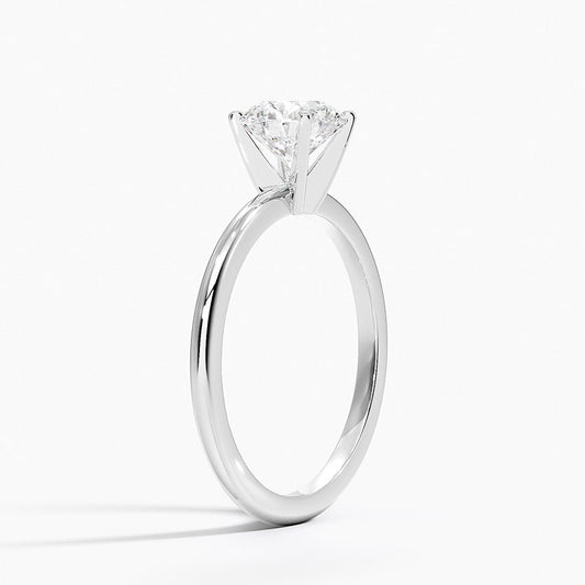 Solitaire white gold engagement ring with round 1 carat diamond in four-prong setting