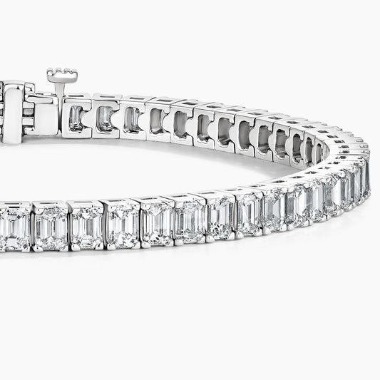 White gold tennis bracelet with emerald-cut lab-grown diamonds on white background