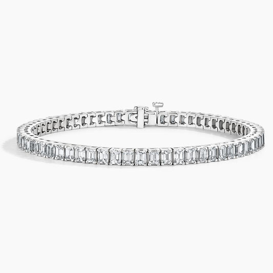 White gold tennis bracelet with emerald-cut lab-grown diamonds on a white background