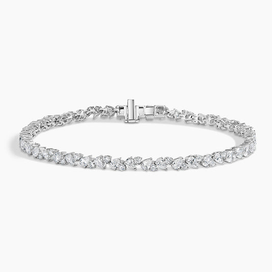 White gold tennis bracelet with fancy-cut lab-grown diamonds on a white background