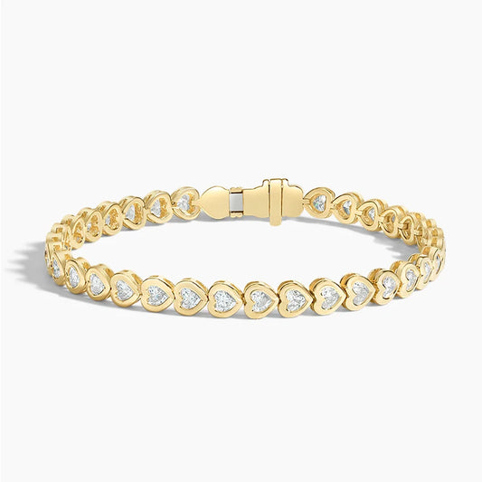 Yellow gold tennis bracelet with heart-shaped lab-grown diamonds, elegant jewelry