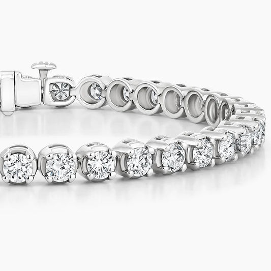 White gold tennis bracelet with round lab-grown diamonds on a white background.