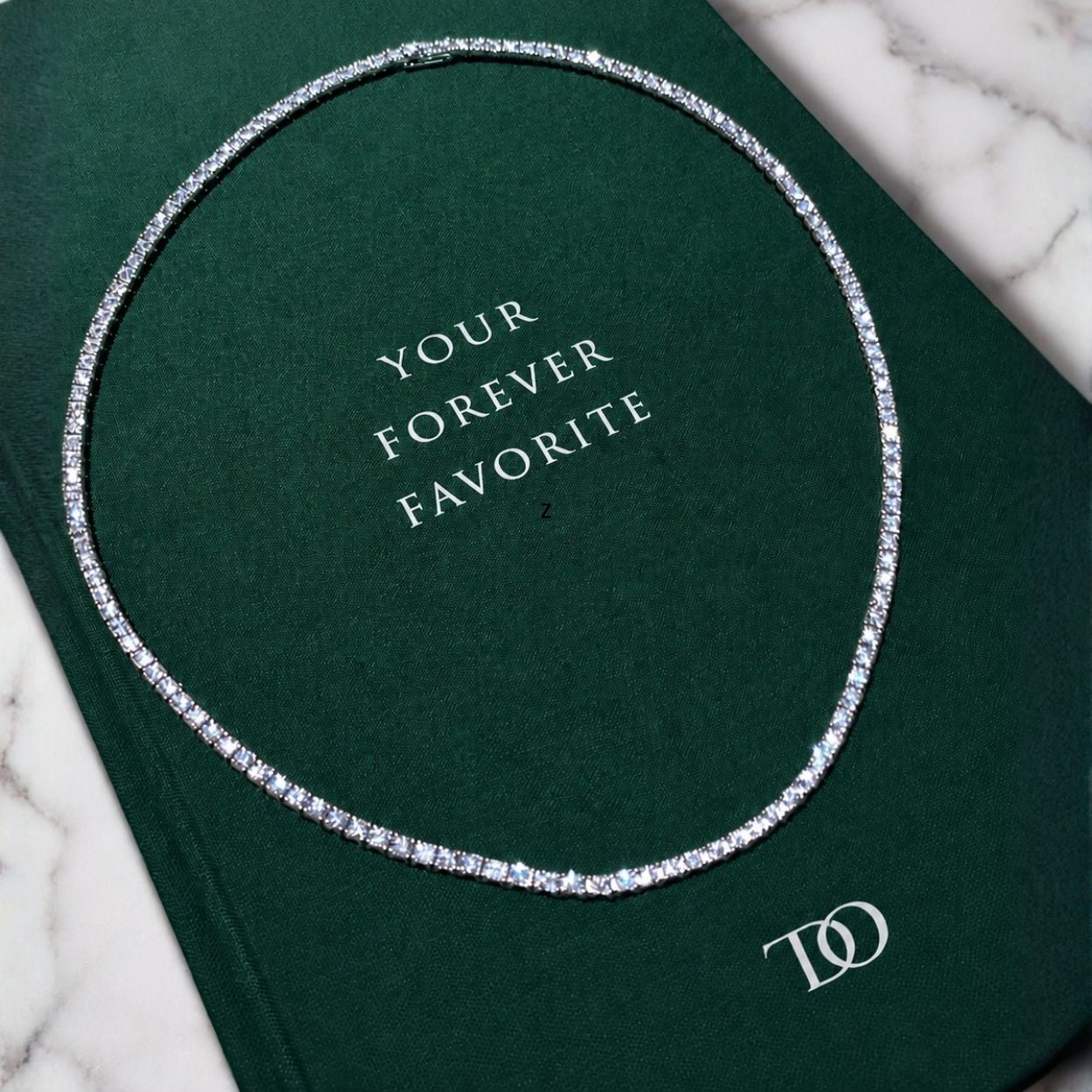 Diamond tennis necklace on a green box with 'Your Forever Favorite' text, ecomposer-metal type-white-gold-18k, ecomposer-metal type-yellow-gold-18k, ecomposer-metal type-rose-gold-18k