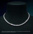 Diamond tennis necklace on a emerald-green mannequin with a dark , ecomposer-metal type-white-gold-18k, ecomposer-metal type-yellow-gold-18k, ecomposer-metal type-rose-gold-18kbackground