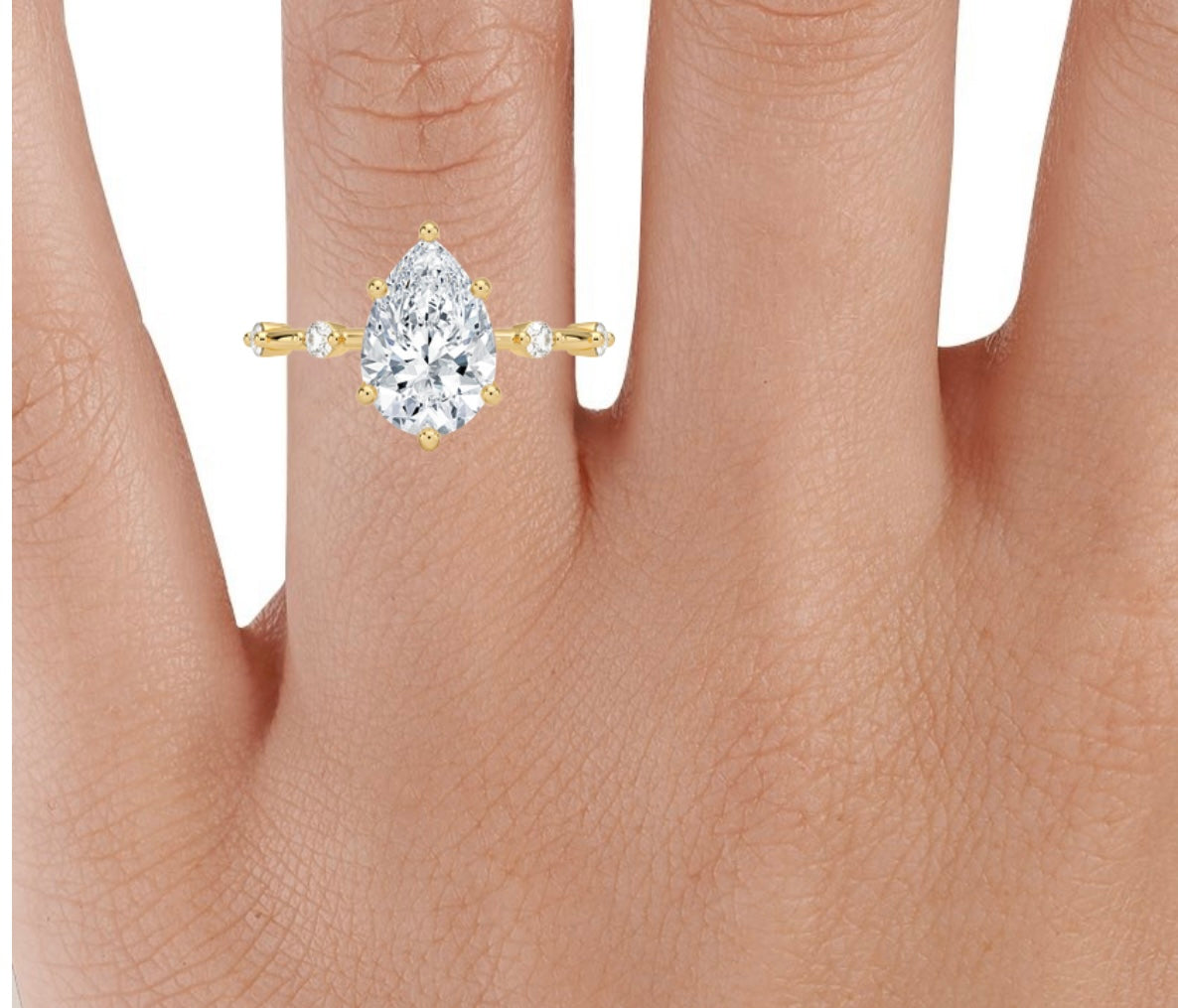 2 carat pear IGI certified lab grown diamond VS1 F . Yellow gold 18karat.