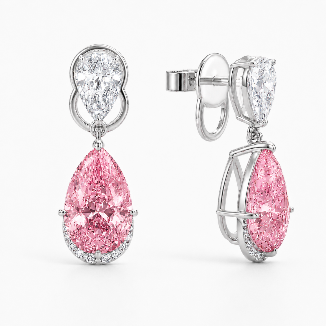 A pair of high-end drop earrings featuring a large pink pear-cut diamond and a smaller round diamond in a silver-toned setting, shown on a clean white background.