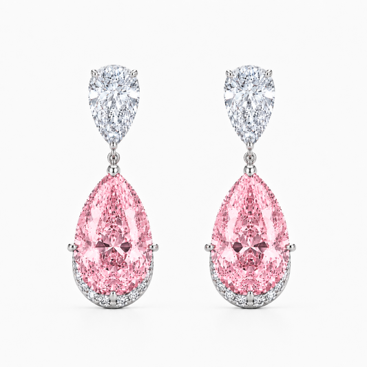 A pair of drop earrings featuring large pear-shaped pink diamonds set in silver-toned metal, with smaller round diamonds above in pear-cut shapes, shown on a light gray background.