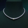 Diamond necklace on a dark green mannequin, ecomposer-metal type-rose-gold-18k, ecomposer-metal type-white-gold-18k, ecomposer-metal type-yellow-gold-18k