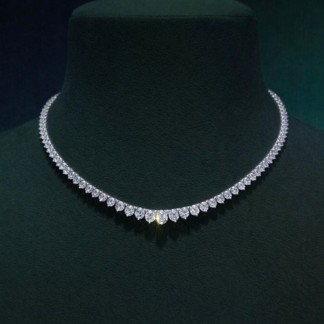 Diamond necklace on a dark green mannequin, ecomposer-metal type-rose-gold-18k, ecomposer-metal type-white-gold-18k, ecomposer-metal type-yellow-gold-18k