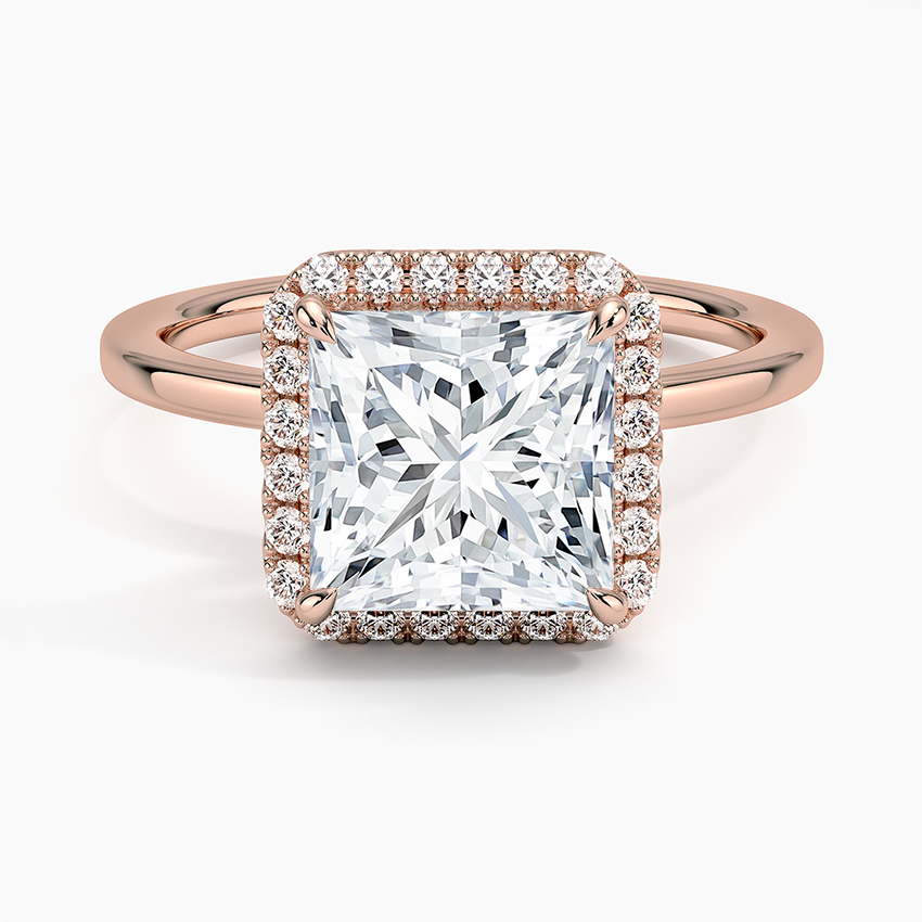 Princess cut diamond halo engagement ring with rose gold band and pavé diamonds