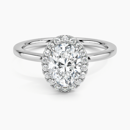 Oval halo platinum engagement ring with 1 carat center stone and pavé diamond accents