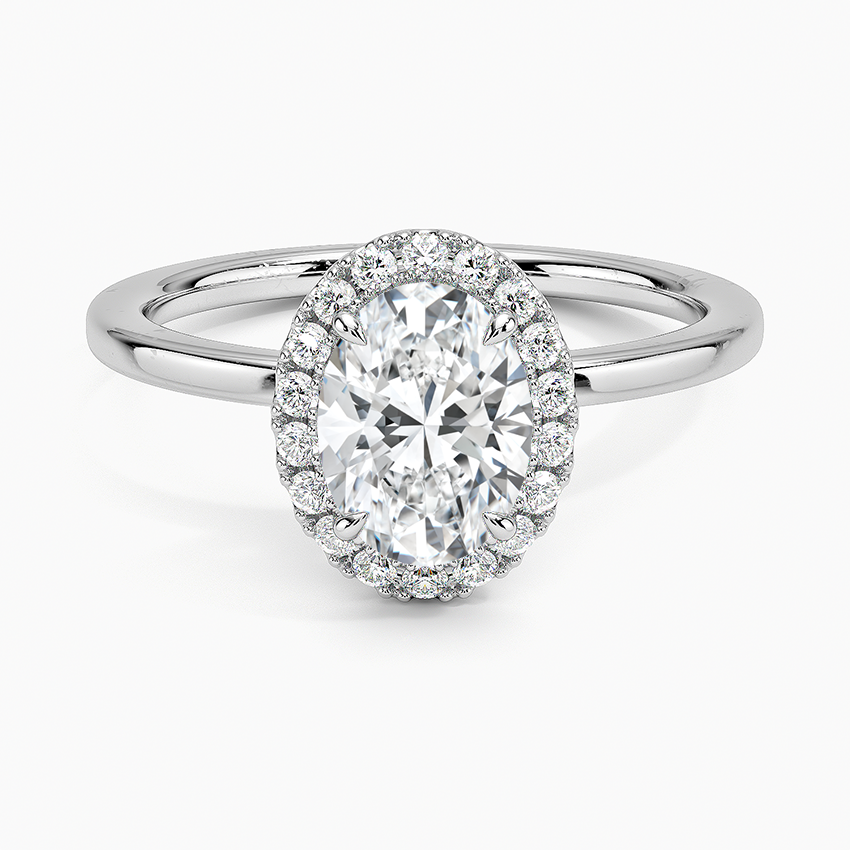 Oval halo platinum engagement ring with 1 carat center diamond and pavé setting