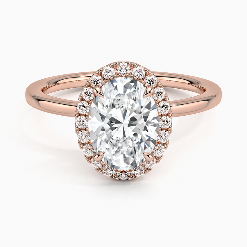 Oval lab-grown diamond halo engagement ring in rose gold with pavé setting