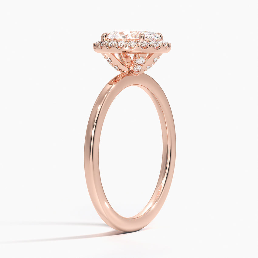 Rose gold oval halo engagement ring with lab-grown diamond and pavé accents