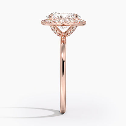 Side view of oval halo rose gold engagement ring with lab-grown diamond and pavé accents.