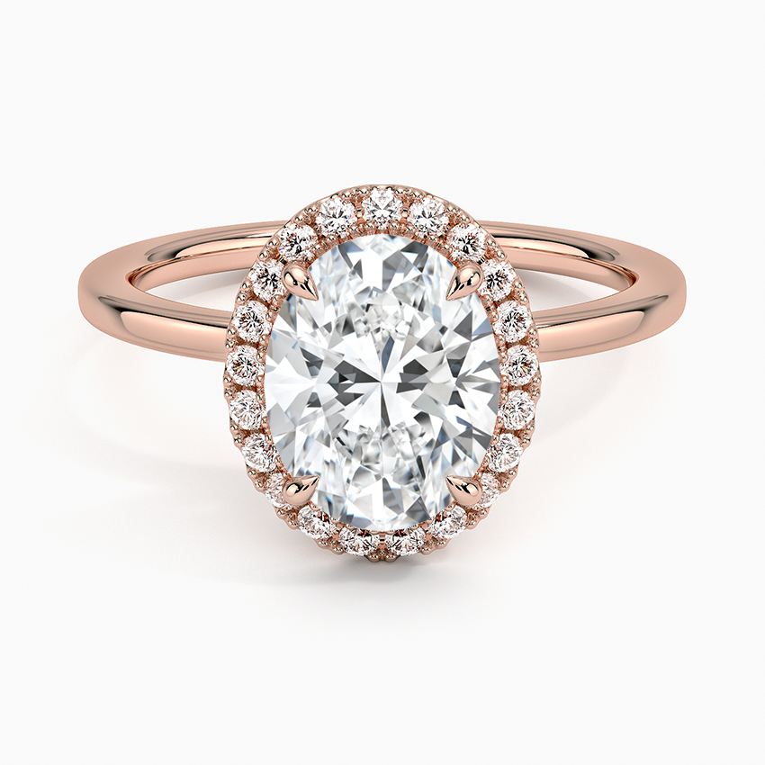Oval halo engagement ring with rose gold band and pavé lab-grown diamonds