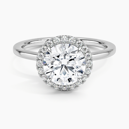 Round halo platinum engagement ring with large center diamond and pavé setting