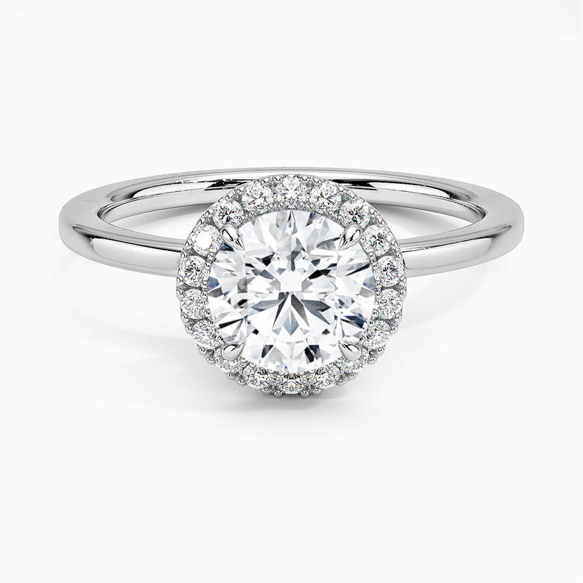 Platinum halo engagement ring with round 1 carat center diamond and pavé setting