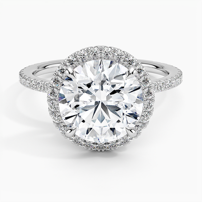 Platinum round halo engagement ring with pavé diamonds and large center stone