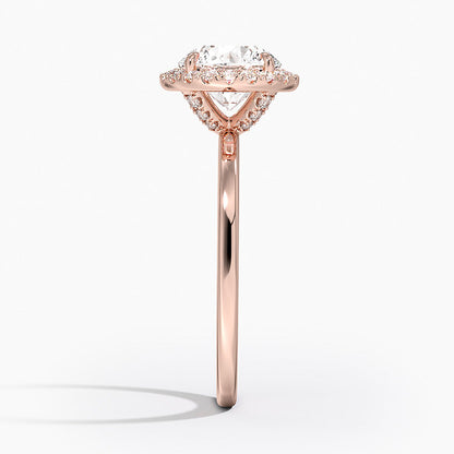 Rose gold engagement ring with round lab-grown diamond and halo setting, side view