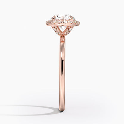 Rose gold halo engagement ring with round lab-grown diamond and accent stones
