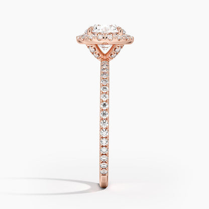 Rose gold halo engagement ring with round lab-grown diamond center and pavé band