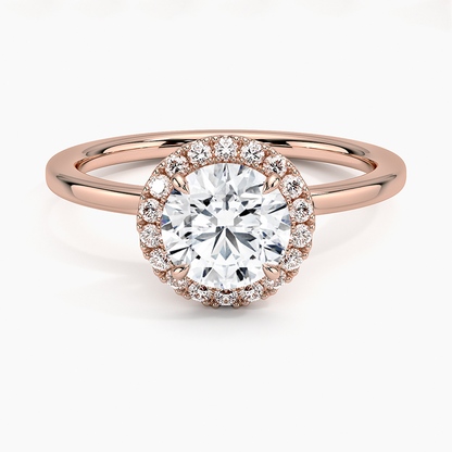 Round halo lab-grown diamond engagement ring in rose gold with pavé setting