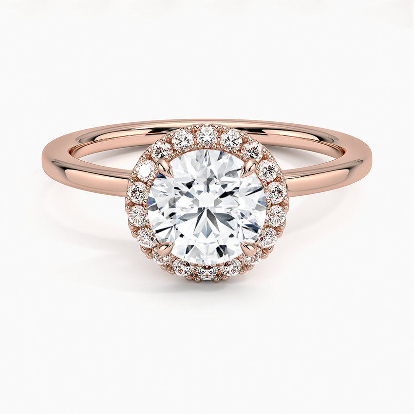 Rose gold halo engagement ring with round lab-grown center diamond and pavé setting