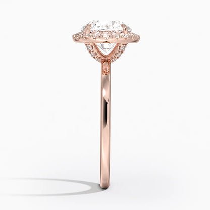 Side view of rose gold halo engagement ring with round lab-grown diamond and pavé setting