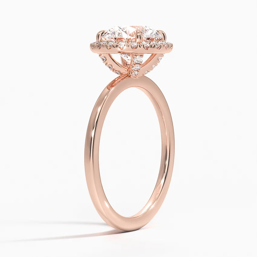 Rose gold halo engagement ring with round lab-grown diamond and pavé setting