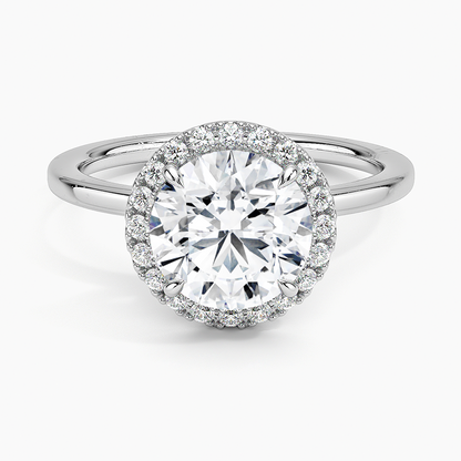 Round halo engagement ring with white lab-grown diamond center and pavé diamond accents
