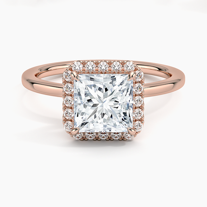 Princess cut diamond halo engagement ring in rose gold with pavé setting