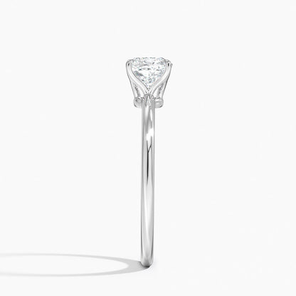 Side view platinum engagement ring with 1ct cushion solitaire diamond on plain band