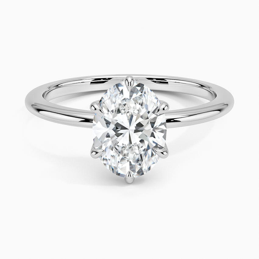 Solitaire oval-cut white diamond engagement ring with sleek gold band