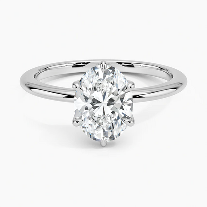 Solitaire oval lab-grown diamond engagement ring with white gold band on white background