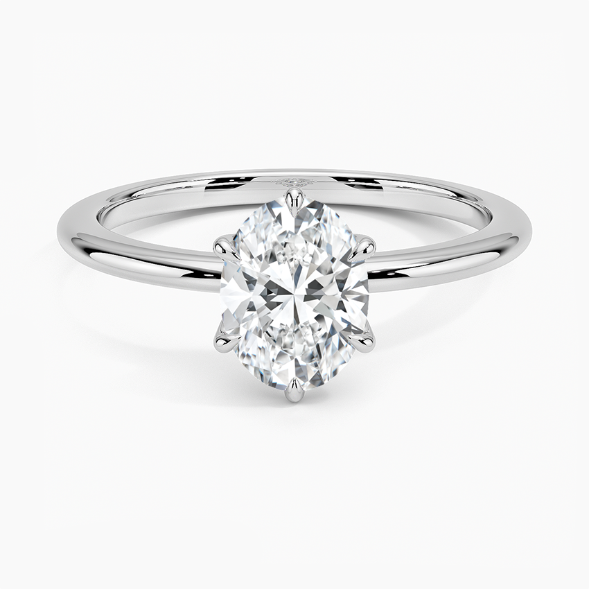 Oval solitaire white gold engagement ring with a 1 carat lab-grown diamond on plain band