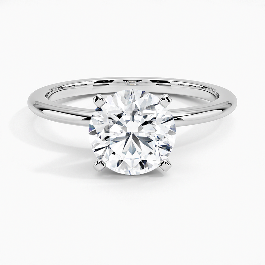 1.5 carat round lab-grown diamond solitaire engagement ring in white gold with 4-prong setting