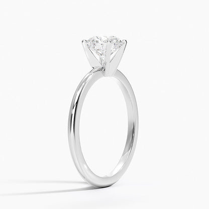 White gold solitaire engagement ring with round 1 carat diamond in 4 prong setting