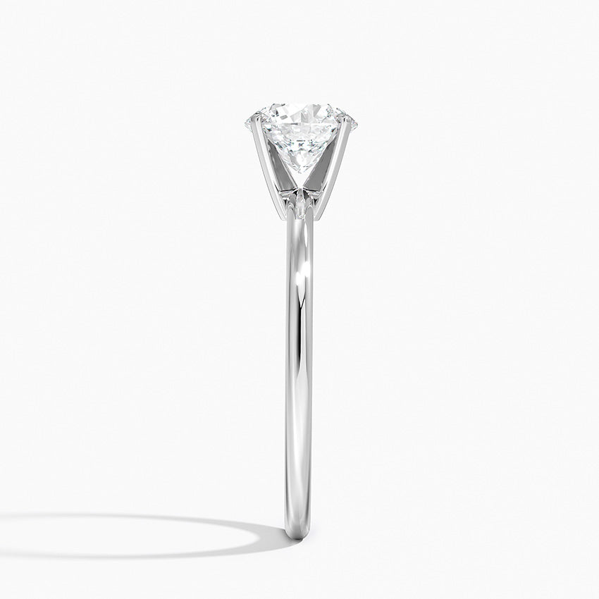 Side view of a solitaire white gold engagement ring with round lab-grown diamond